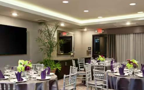 Hilton Garden Inn meeting room with round tables and table setting