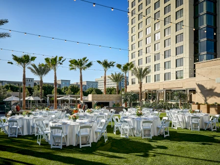 outdoor event space with round tables and chairs at marriott irvine spectrum