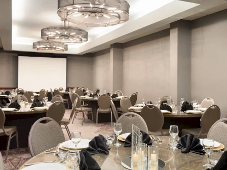 round table set up with round ceiling lights at embassy suites