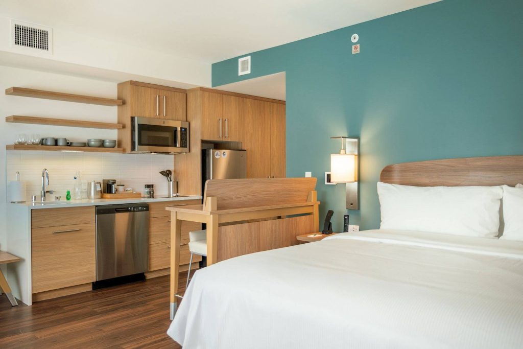 hotel room with bed, microwave, wooden cupboards, refrigerator at element hotel irvine