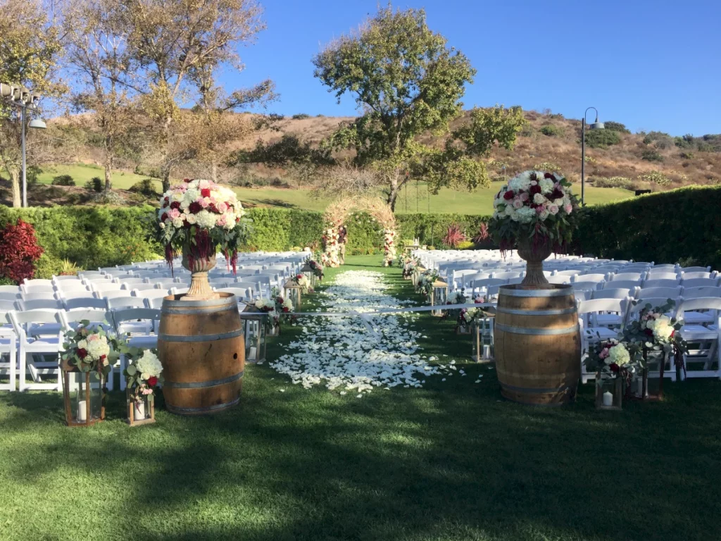 wedding ceremony outdoor set up at strawberry farms with petals on the ground