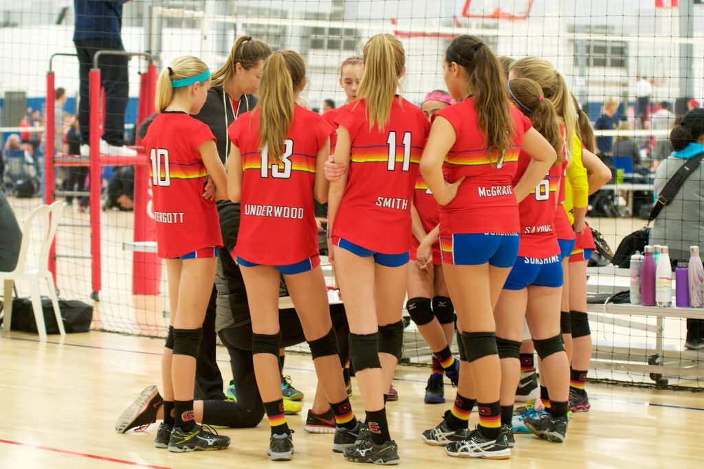 female players huddled at momentous sports in irvine