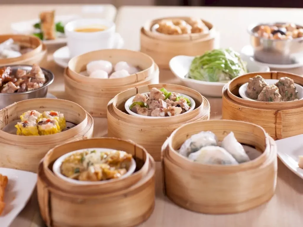A table full of food showcases trying different cuisine as a popular thing to do in irvine