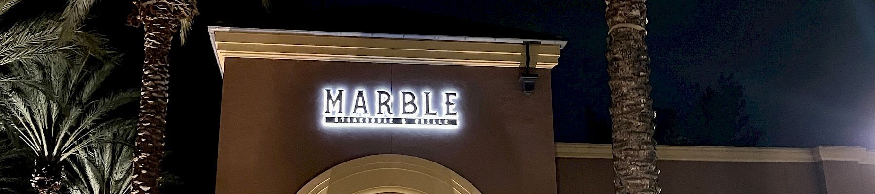 exterior of Marble Steakhouse in the evening