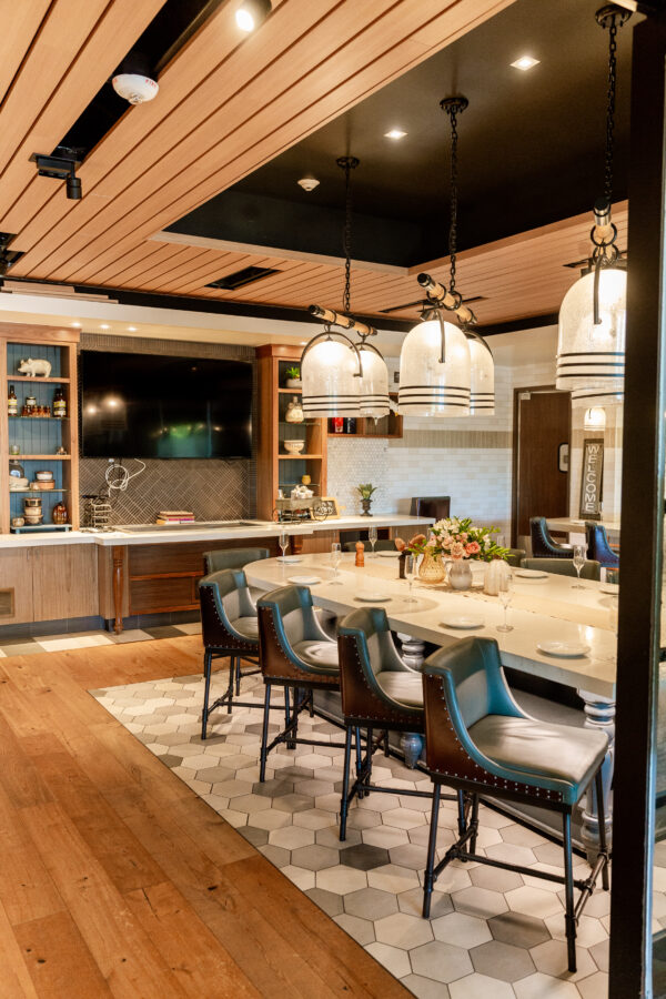 private restaurant room with long table, chairs and hanging lights