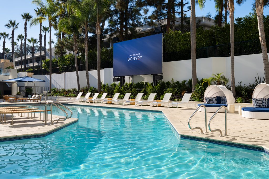 pool area with huge tv at irvine marriott during daytime