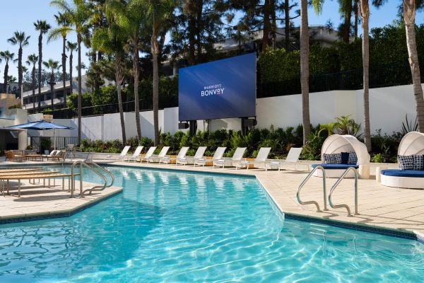 pool area with huge tv at irvine marriott during daytime