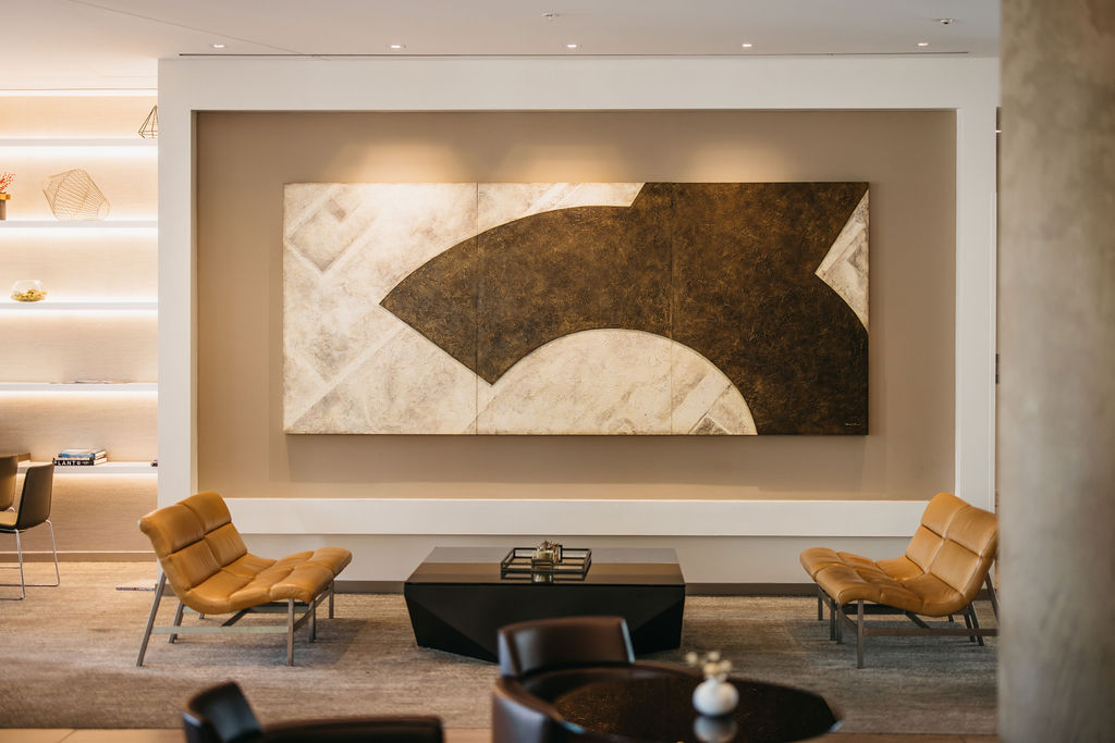 lobby with tan lounges, coffee table, and big artwork at ac hotel irvine