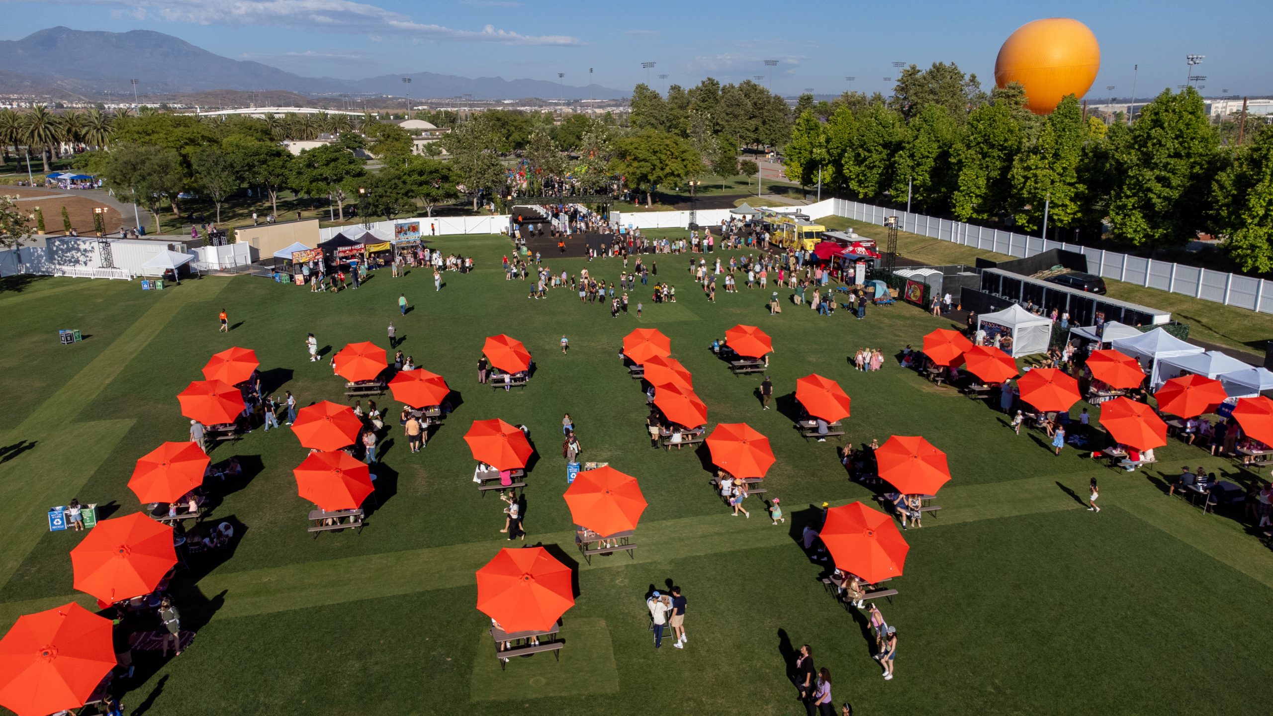 aerial shot of The Layover event during day time with the Great Park Balloon