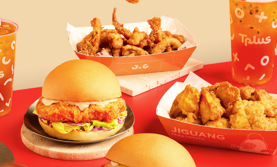table of chicken wings, chicken sandwich, and chicken skins from j & G fried chicken