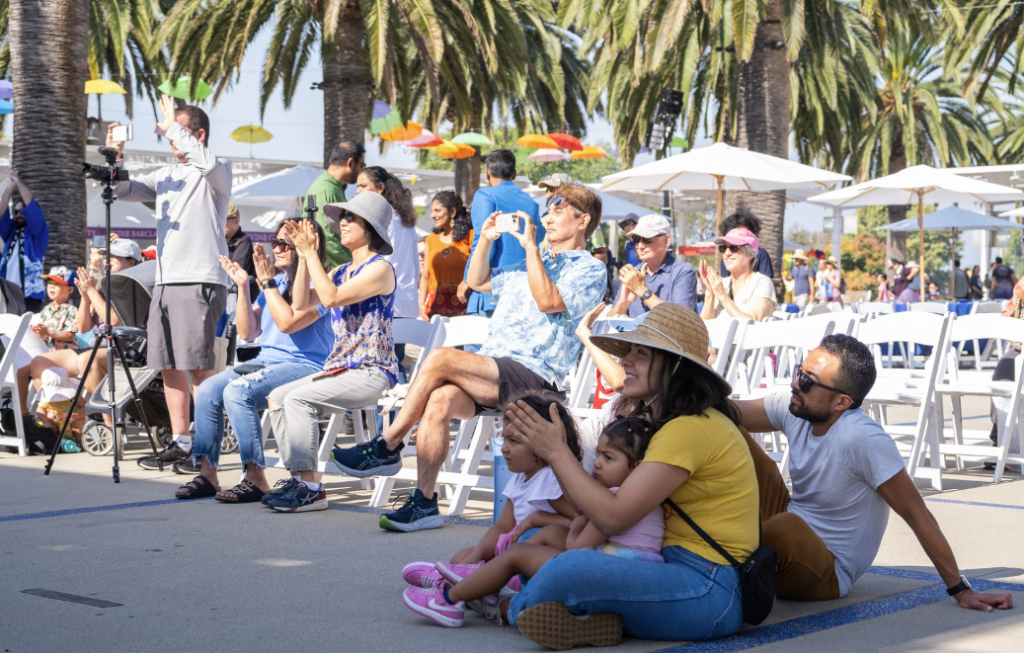이벤트 3 event attendees watching a performance at one of the things to do this weekend in orange county