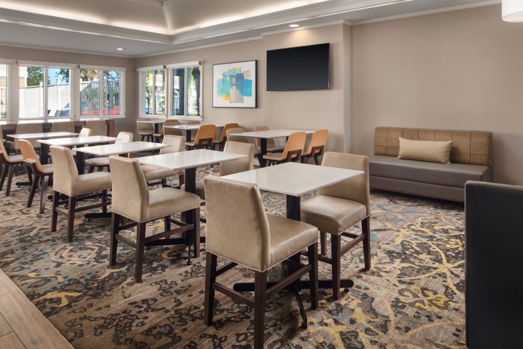 dining area with tv and sofa at residence inn irvine spectrum hotel