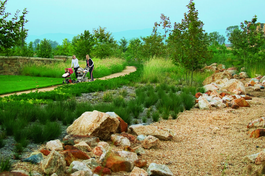 two moms pushing a stroller with their babies at jeffrey open space trail irvine
