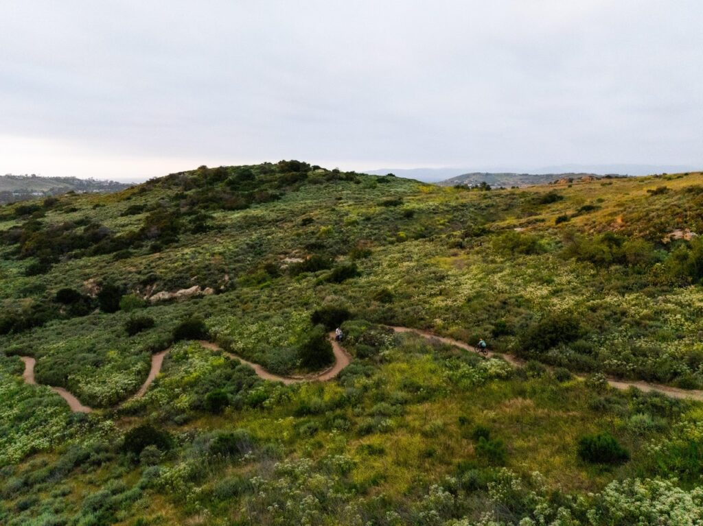 aerial view of bommer canyon trail with biker