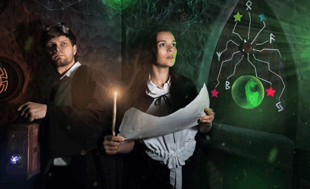 woman holding a big white paper and wand with a man behind her in a dark place