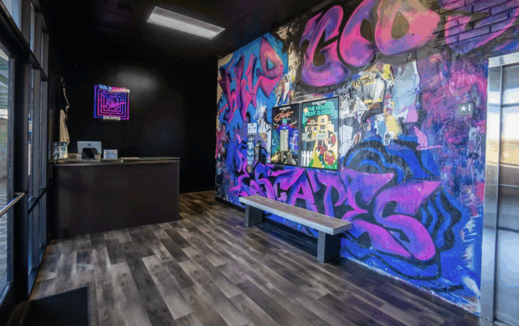 front desk reception with graffiti on the wall