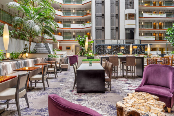 lobby with tables and chairs at embassy suites