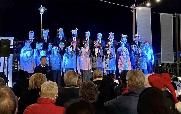 christmas carolers performing on stage