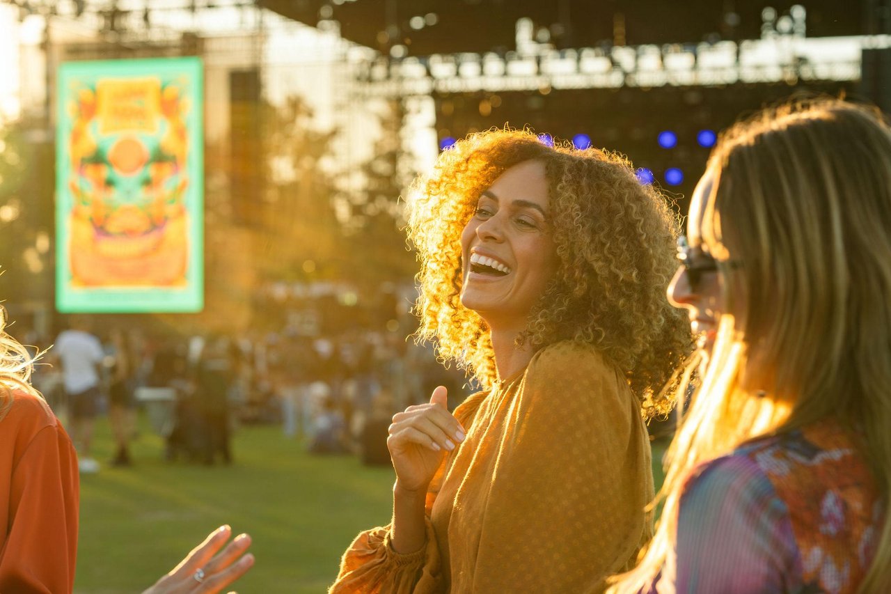 Events 4 photo of a woman in an outdoor event space called great park live during daytime smiling