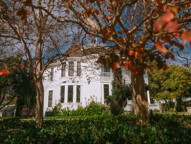 a white traditional historic two story house