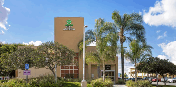 exterior building of extended stay suites hotel in irvine