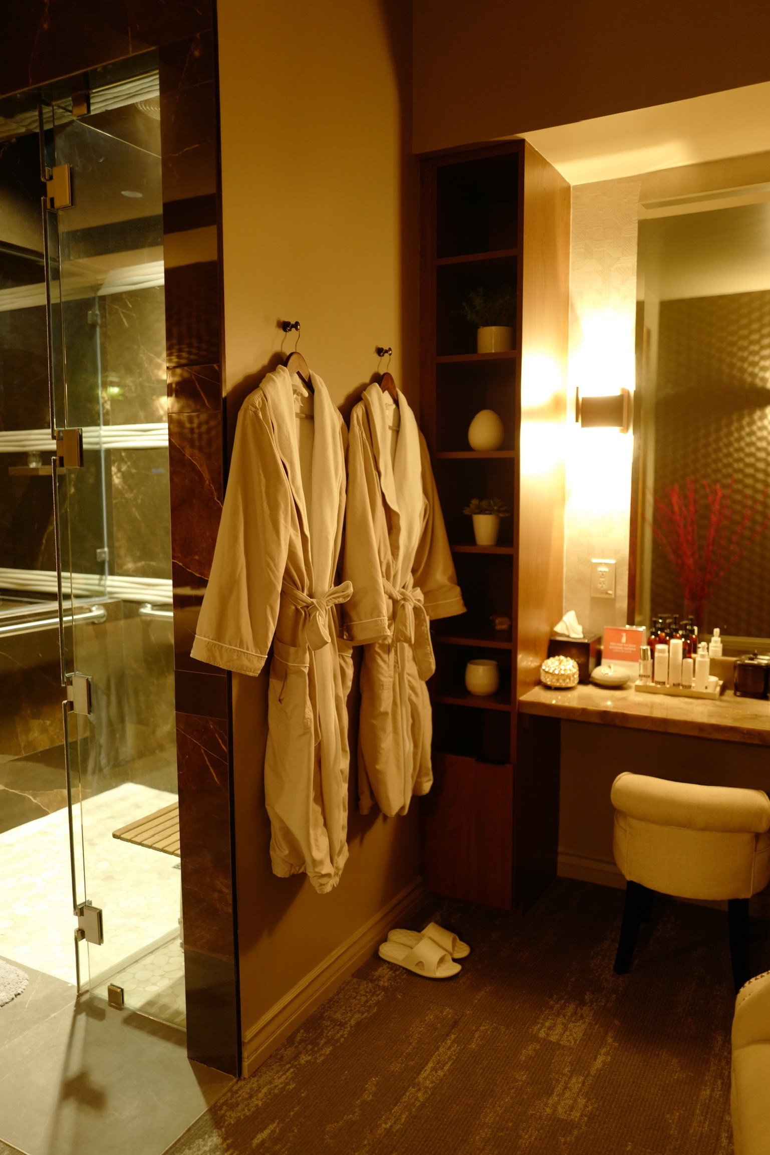 private royal suite with private shower and two robes and vanity area