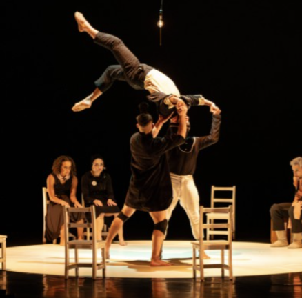 dancers performing on stage with chairs around at irvine barclay theater