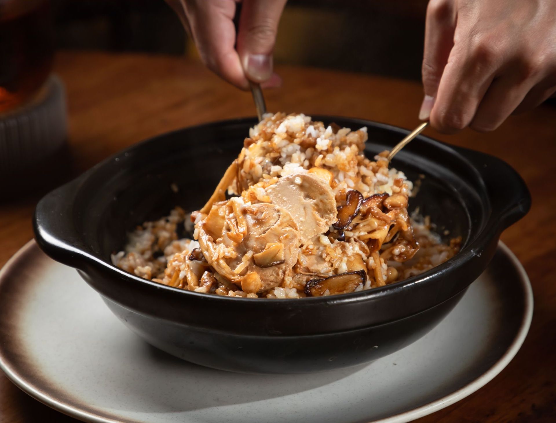 a bow of rice with mushrooms chicken and peanuts