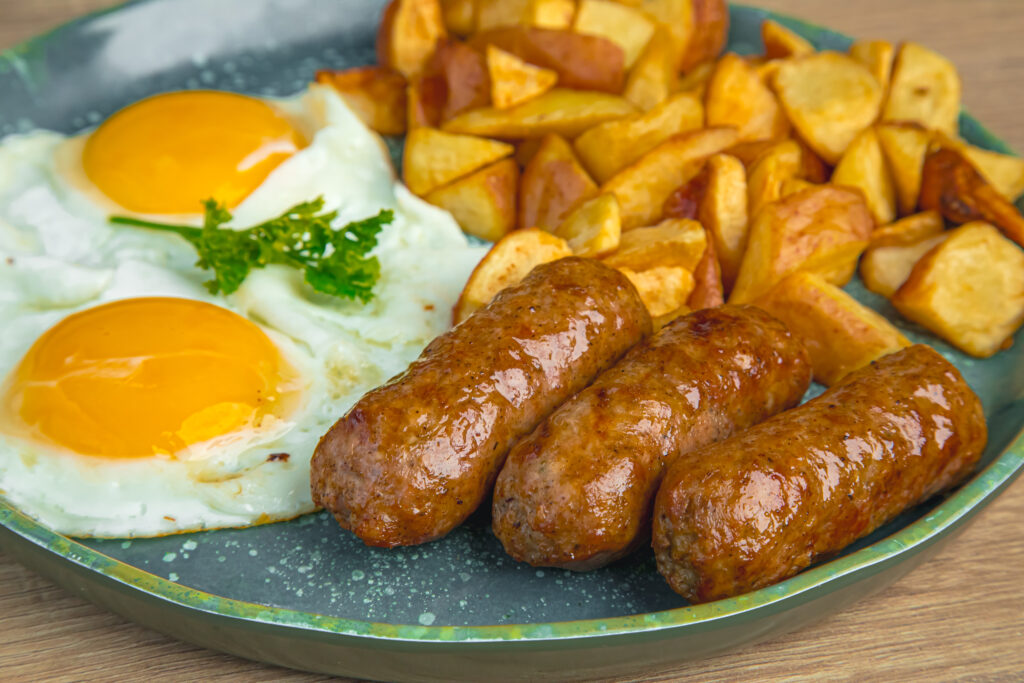 Two eggs and link sausage with potatoes