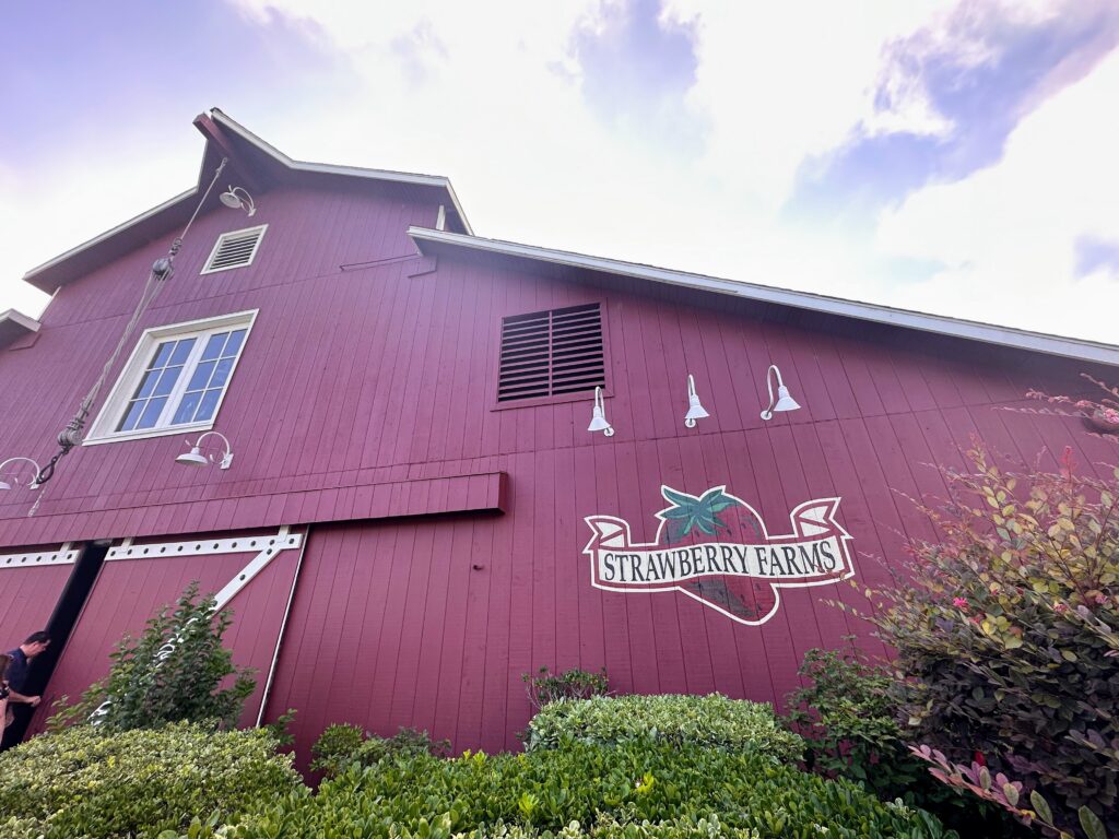 big red farm with sign of Strawberry Farms