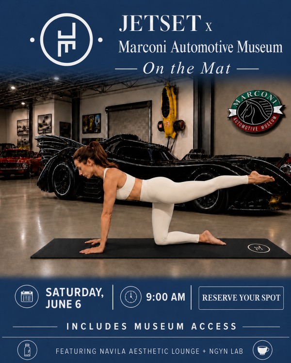 woman in white athletic gear doing pilates on a mat surrounded by cars