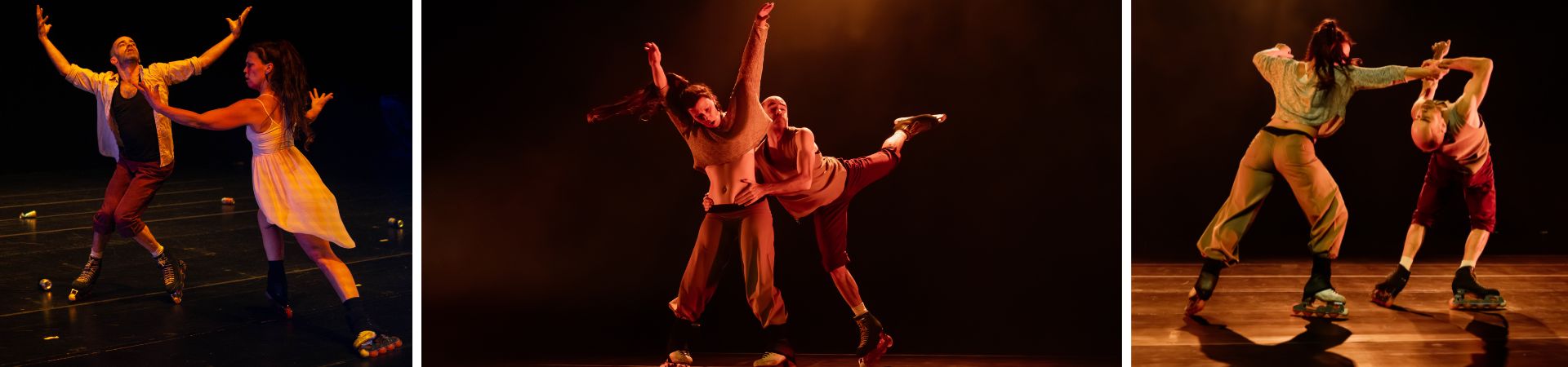 two dancers performing with one with both arms raised upwards and the other hugging the other dancer's waist