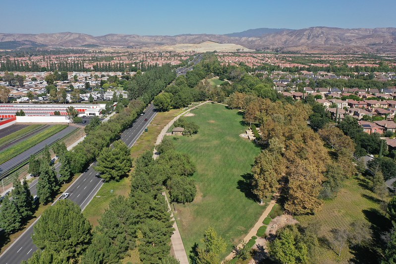 aerial view of green space with trail