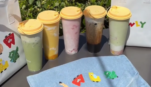 five drinks with yellow covers