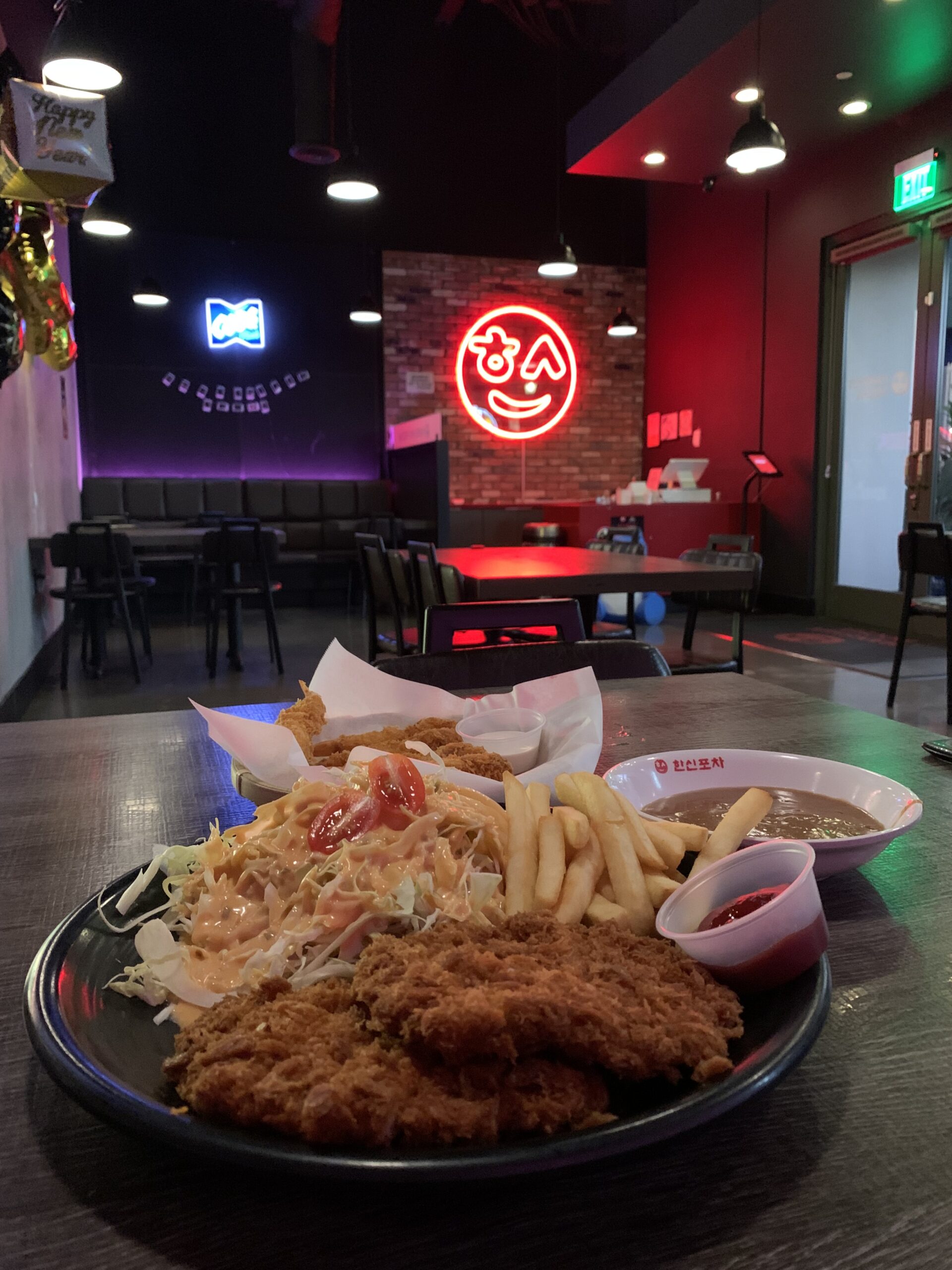 breaded chicken with fries on a table