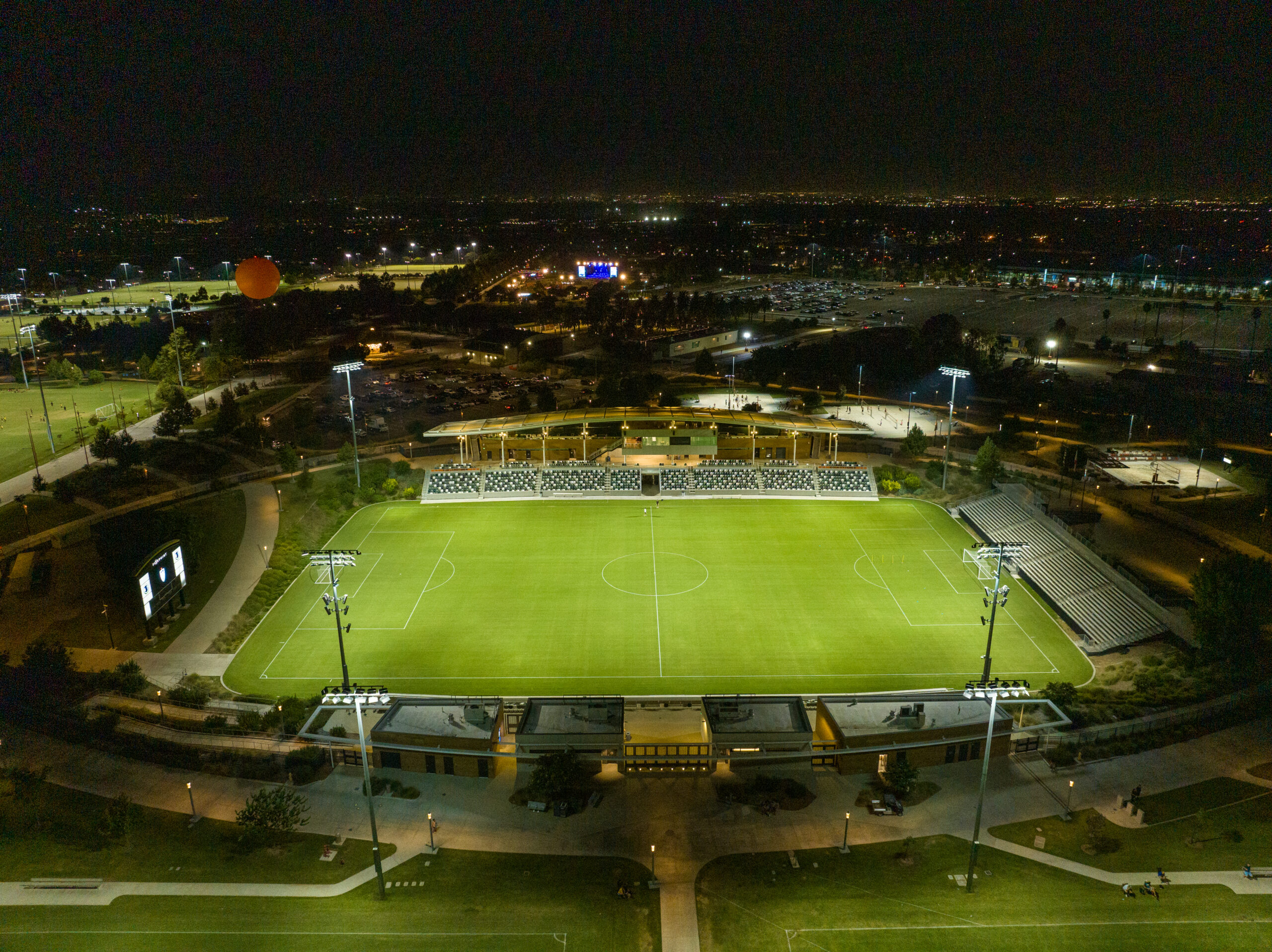 aerial shot of Great Park Championship Soccer Stadium at night