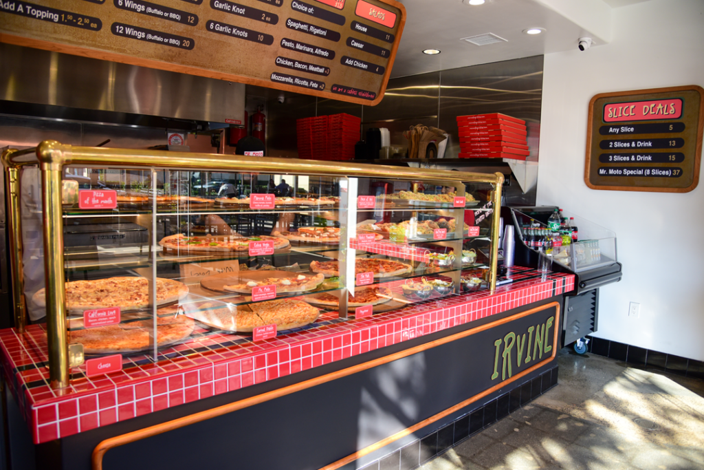 front counter with glass displaying pizzas