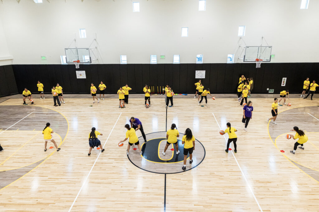 basketball court with group of girls playing