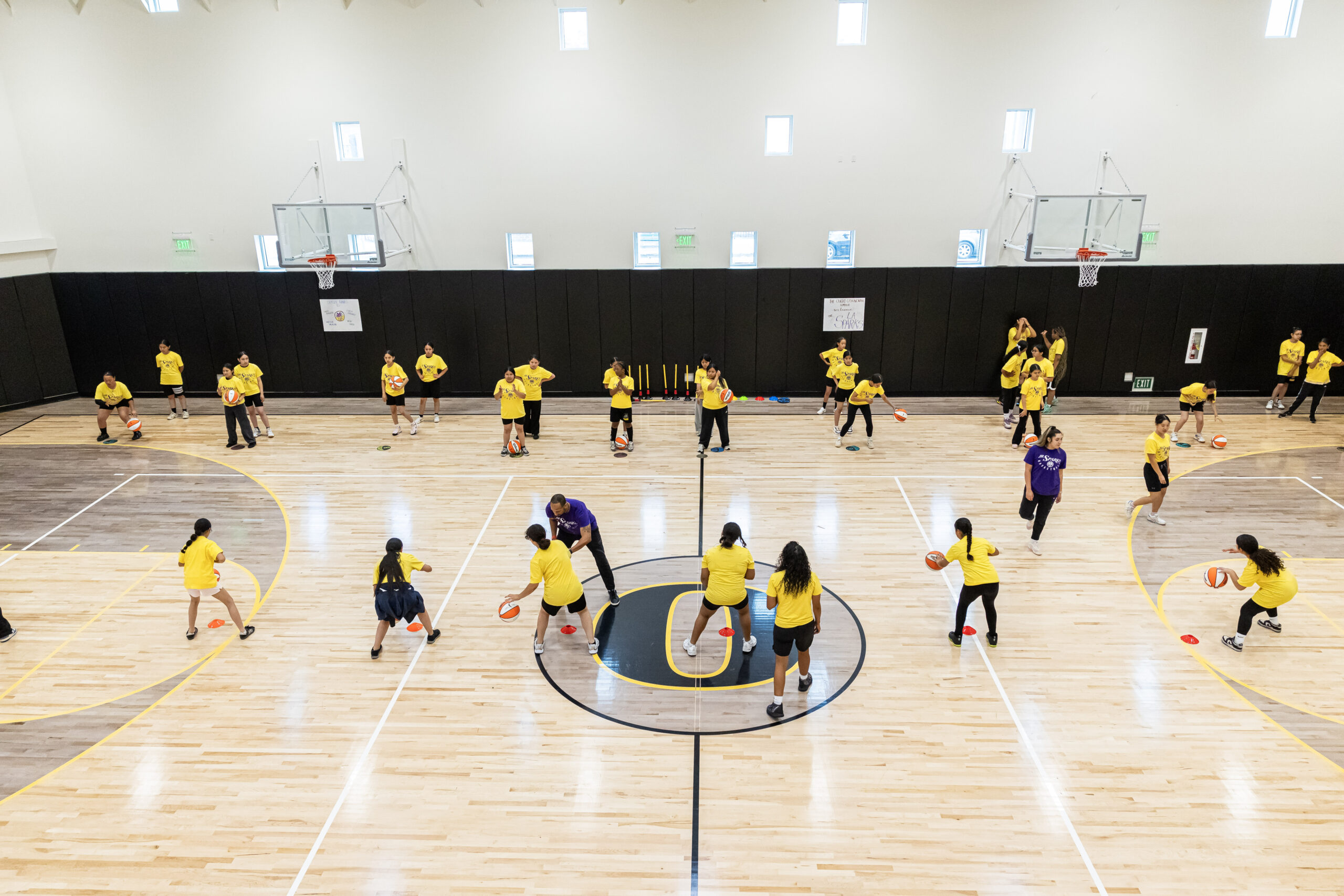 basketball court with group of girls playing